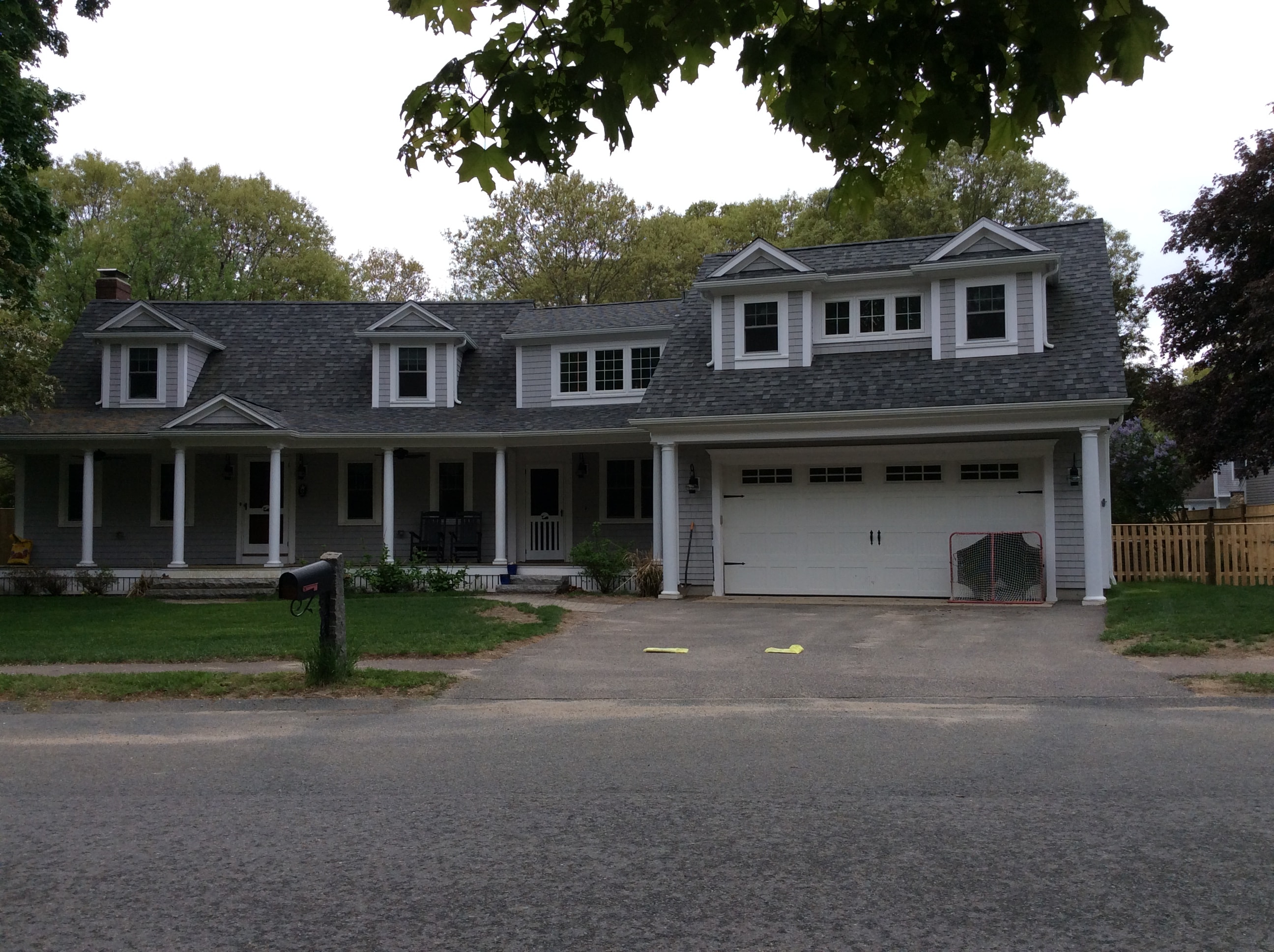 Two-story home addition and porch construction by Boston Js